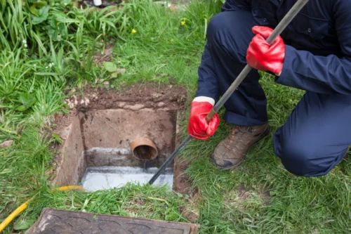 plumber unblocking drain